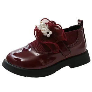 Burgundy patent leather girls shoes with elegant pearl flower and elastic sock cuff