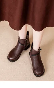 Top-down view of stylish brown leather ankle boots for women featuring a functional side zipper