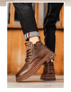 Close-up detail of brown leather Martin boots with embossed logo and textured sole