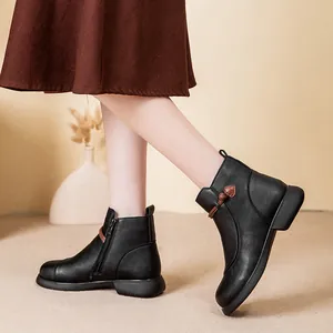 Women's black warm winter ankle boots with side zipper and decorative toggle detail