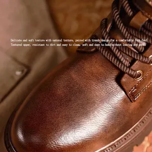 Macro view of retro brown leather Martin boot showing natural grain texture and laces