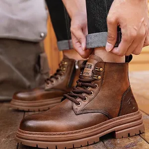 Close-up of premium men's brown leather Martin boots with detailed stitching and laces.