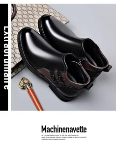 Elegant close-up of men's leather boots featuring side zippers and stylish buckle details.