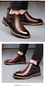 Detail view of brown men's mid-top leather boots with side zipper and double buckles