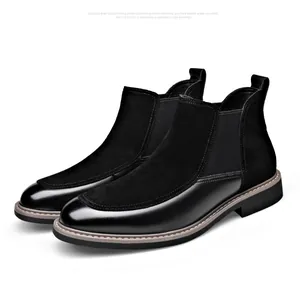 Detail side view of men's black Chelsea boots with smooth leather and suede patchwork