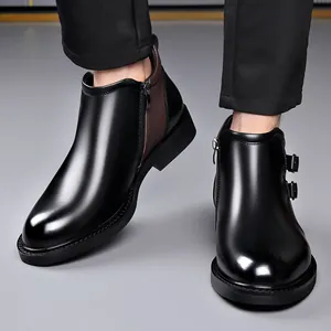 Sleek black men's leather Chelsea boots with side zipper and buckle detail
