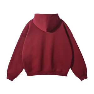 Back view of a men's maroon oversized hoodie with a minimalist no-drawstring hood design.