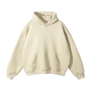 Detailed view of cream oversized hoodie with front kangaroo pocket and ribbed cuffs.