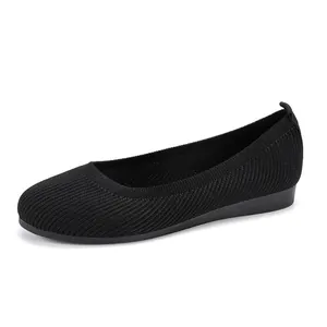Black round toe knit flat shoes for women featuring breathable ribbed mesh texture