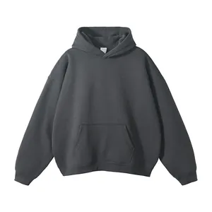 Close-up detail of charcoal grey oversized hoodie with a classic kangaroo pocket