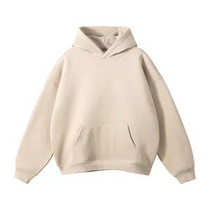 Detailed view of the fabric and design of a beige hoodie with a front kangaroo pocket.