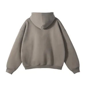 Back view of a minimalist greyish-brown oversized hoodie without drawstrings