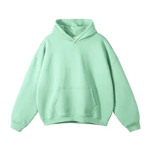 Minimalist mint green oversized hoodie without drawstrings featuring a kangaroo pocket