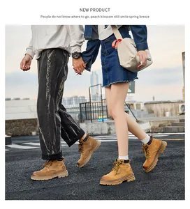 Couple wearing yellow leather work boots for outdoor hiking in urban autumn scenery