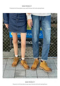 Couple wearing premium mustard yellow leather Martin boots in an outdoor urban setting.