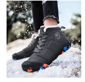 Close-up of children's fleece-lined snow boots worn in an outdoor winter setting