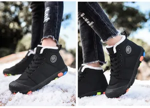 Detail view of black high-top children winter boots with warm white faux fur lining