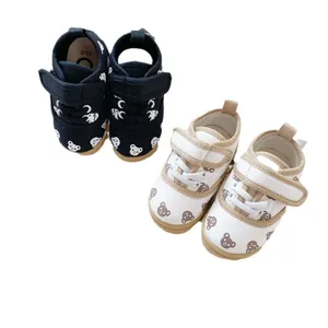 Cute bear pattern baby canvas shoes with soft soles and velcro straps in navy and cream