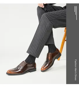 Close-up detail of premium brown crocodile-embossed leather Oxford dress shoes on model