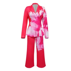 Front view of a women's two-piece suit set with pink floral blazer and matching pants
