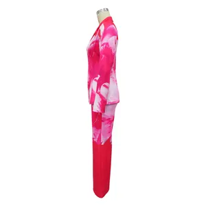 Side view detail of a vibrant pink floral print two-piece blazer and pants set