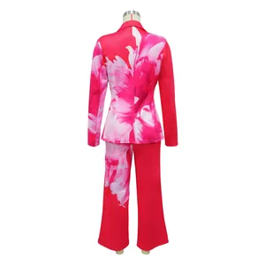 Rear view of vibrant floral print blazer and wide-leg trouser suit for stylish women, pink