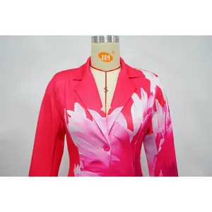 Close-up detail of vibrant fuchsia floral print blazer for women featuring a notch lapel