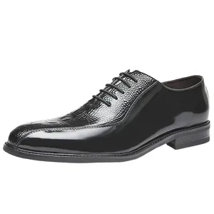 Elegant black leather oxfords with crocodile embossing, perfect for business or weddings.