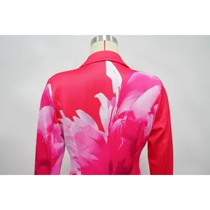 Back detail of a vibrant pink blazer with elegant white floral print on a mannequin