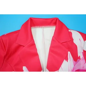 Close-up detail of pink floral print blazer featuring a classic notched lapel design.