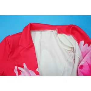 Close-up detail of women's floral printed blazer showing shoulder pads and collar stitching