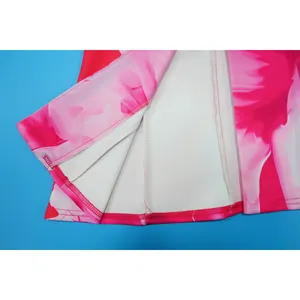 Macro view of interior seams and overlock stitching on pink floral print jacket