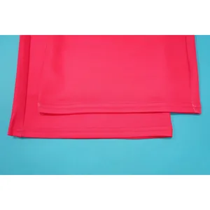 Close-up detail of magenta leisure pants hem with professional double-row stitching detail