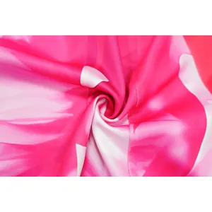 Close-up of vibrant pink and white swirl print fabric texture for women's suit