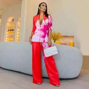 Elegant vibrant red floral print two-piece blazer and wide-leg trouser suit set for women