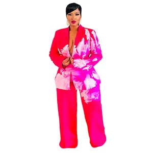 Full view of women's vibrant pink floral print two-piece blazer and trouser set