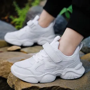 Breathable white mesh athletic sneakers for children featuring durable velcro straps