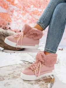 Elegantes botas de nieve rosas con cordones, ribete de piel y suela de plataforma blanca