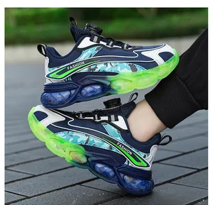 Detailed view of boys breathable sports shoes with neon green soles and twist buckle