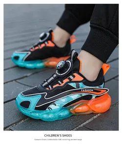 Modern boys' sports sneakers featuring a rotary buckle closure and breathable mesh upper