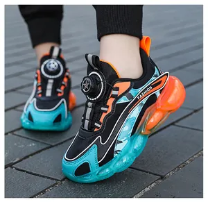 Close-up of boys sports shoes with rotary buckle and teal orange camouflage design