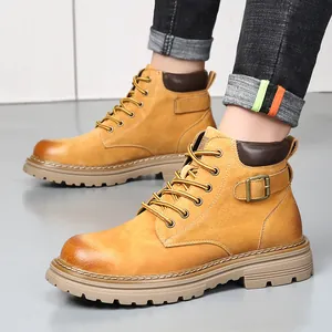 Men's leather work boots in yellow tan finish with lace-up design and buckle detail
