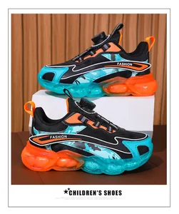 Detail view of boys' athletic shoes featuring a rotating buckle and vibrant camo design