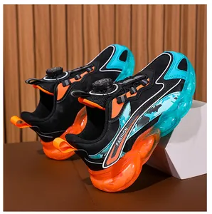 Detailed view of breathable kids sports shoes featuring a rotary buckle and vibrant sole