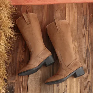 Close-up detail of the premium brown suede on these fashion square-heel tall boots
