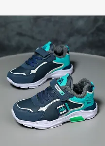 Close-up detail of boys winter sneakers with thick warm fur lining and velcro strap