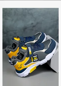 Detailed side view of warm winter sports shoes for boys with grey faux fur lining.