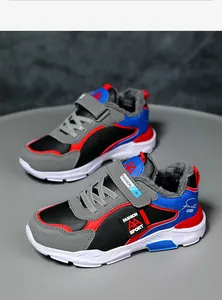 Close-up of boys' warm winter sneakers with thick faux fur lining and velcro strap