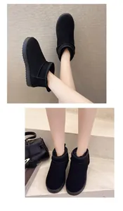 Close-up view of black fur-lined winter snow boots for women with thick sole.