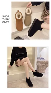 Detailed view of stylish women's warm fleece-lined winter snow boots shown on stairs